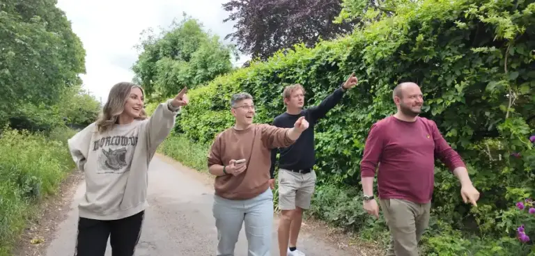 GPS Treasure Hunt group pointing at landmark