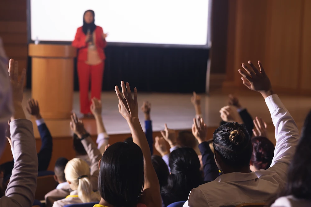 Businesswoman standing around the podium in the auditorium