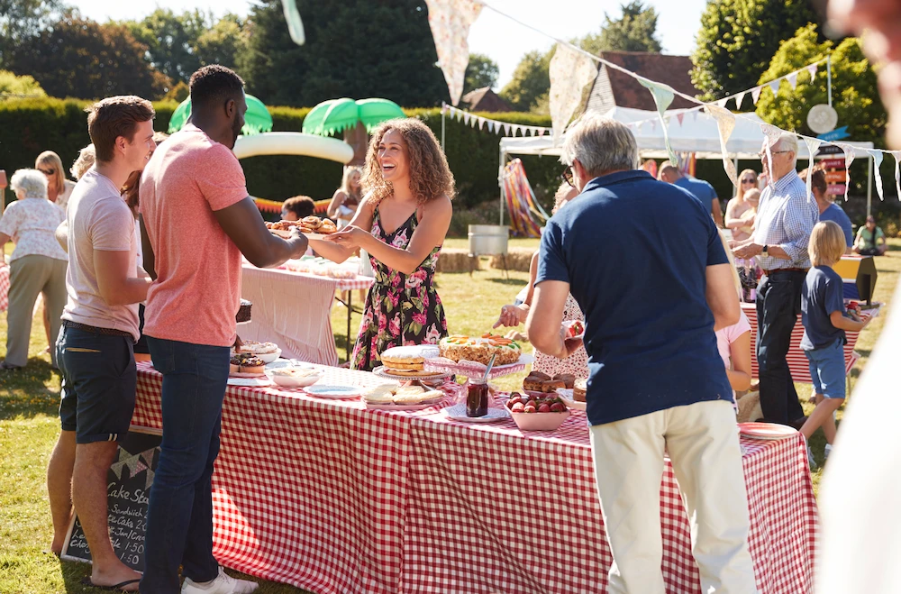 Busy Cake Stall At Summer Festival Fun Day