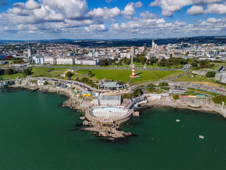 Aerial view of Plymouth Hoe, showcasing the iconic Smeaton's Tower lighthouse and waterfront