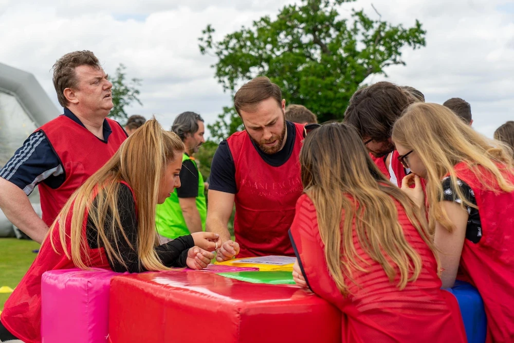 outdoor team building event group solving a puzzle